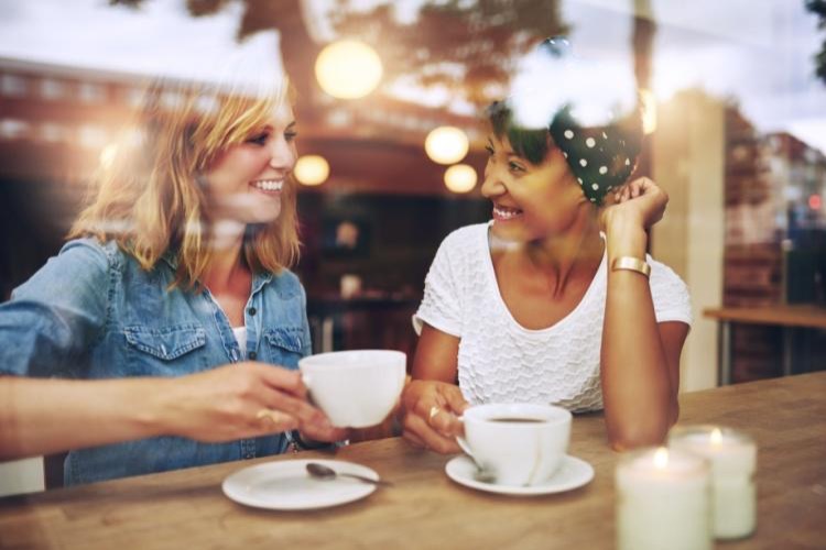 Two sober women enjoy a cup of coffee together