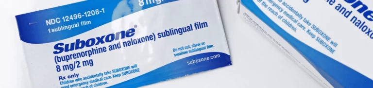 Two boxes of Suboxone and a sublingual Suboxone tab