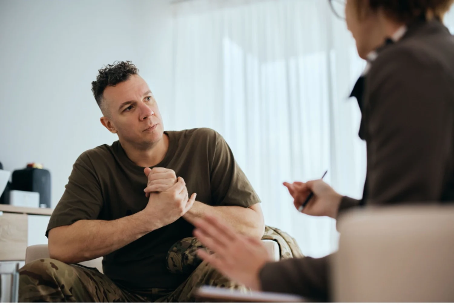 Veteran with PTSD talks to a therapist