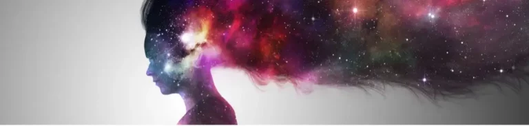 Artistic rendition of a galaxy overlaid on the silhouette of a woman with long flowing hair