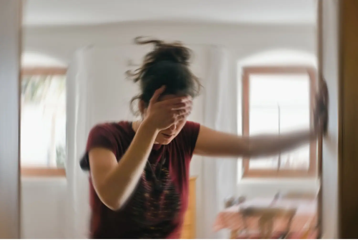 Blurry image of woman experiencing a seizure during alcohol withdrawal