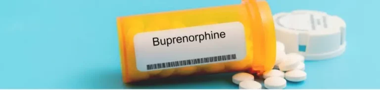 Bottle of buprenorphine pills knocked over with pills spilling out