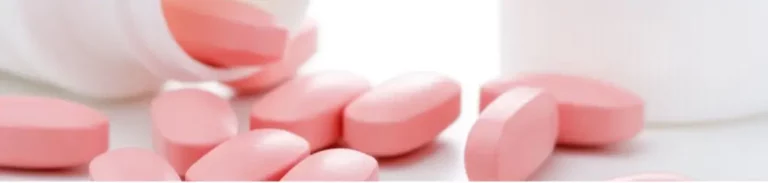 Paxil pills scattered near overturned pill bottle