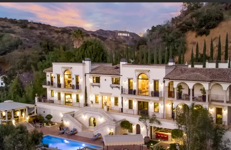 Exterior shot of Legacy's luxury drug and alcohol rehab in the Hollywood Hills, with mansion and pool area in the style of a modern Roman villa