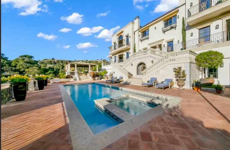 Legacy's luxury drug and alcohol rehab in the Hollywood Hills, with mansion and pool area in the style of a modern Roman villa on a sunny day