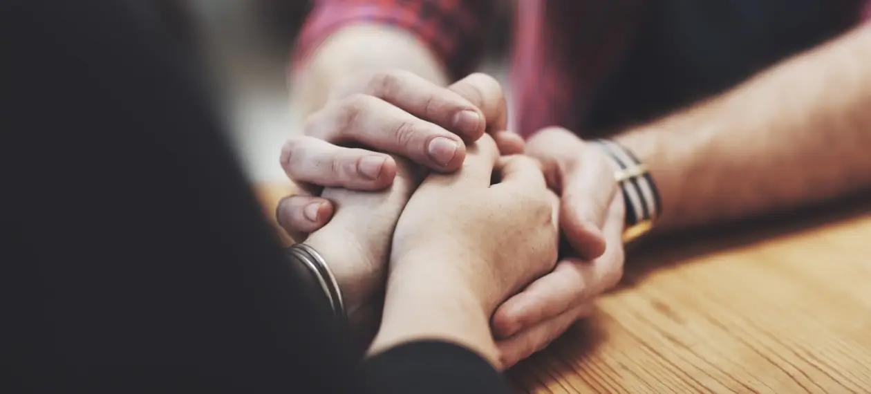 A supportive conversation between friends addressing addiction.